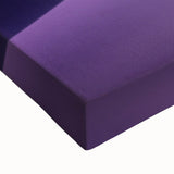 Close-up of a stretched canvas print showcasing a vibrant desert landscape, featuring rich hues of orange and yellow with intricate details, ideal for home decor.