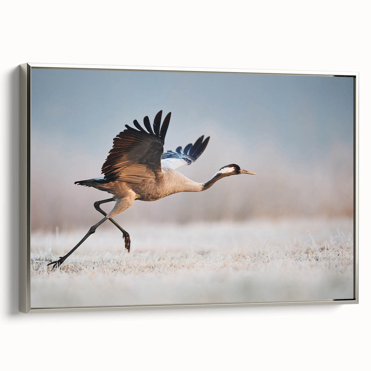Framed canvas wall art showcasing a modern abstract design in silver hues, elegantly displayed from a side view, perfect for contemporary home decor.