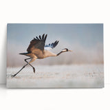 Stretched canvas wall art featuring a modern abstract design with vibrant colors, elegantly leaning against a wall, perfect for contemporary home decor.