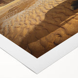 Rolled canvas showcasing a vibrant African wall art design with intricate patterns and warm colors. The artwork is elegantly packaged in a protective cardboard tube, ideal for home decor enthusiasts.
