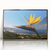 Framed wall art showcasing a vibrant Bird of Paradise floral design in a gold-accented frame, ideal for modern home decor, adding elegance and color to any space.