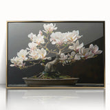 Framed wall art featuring a botanical bonsai tree design with vibrant flowers, elegantly displayed in gold-accented acrylic, ideal for home decor.