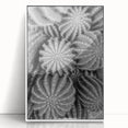 Framed wall art featuring a botanical cactus design in vibrant greens and earthy tones, set against a sleek white background, perfect for modern decor.
