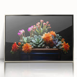 Framed wall art featuring a botanical cactus design in silver acrylic frame, showcasing vibrant green cacti against a neutral background, perfect for modern decor.