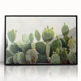 Framed botanical wall art featuring a vibrant cactus design in a sleek black frame, perfect for modern home decor, adding a touch of nature and elegance.