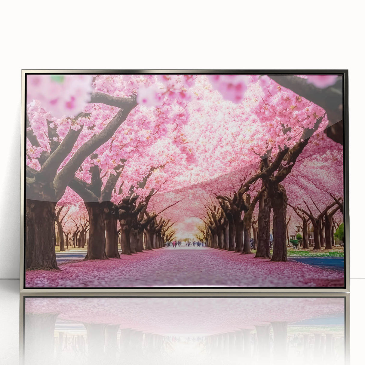 Framed wall art showcasing a delicate cherry blossom botanical design in vibrant pinks and greens, set in a sleek silver frame, perfect for home decor.