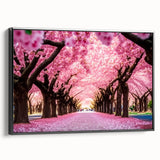 Framed canvas wall art showcasing a detailed cherry blossom botanical design in soft pink and white hues, presented in a sleek black frame for modern decor.