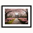 Elegant black-framed wall art featuring a botanical cherry blossom design, showcasing delicate pink flowers and green leaves against a white background, ideal for home decor.