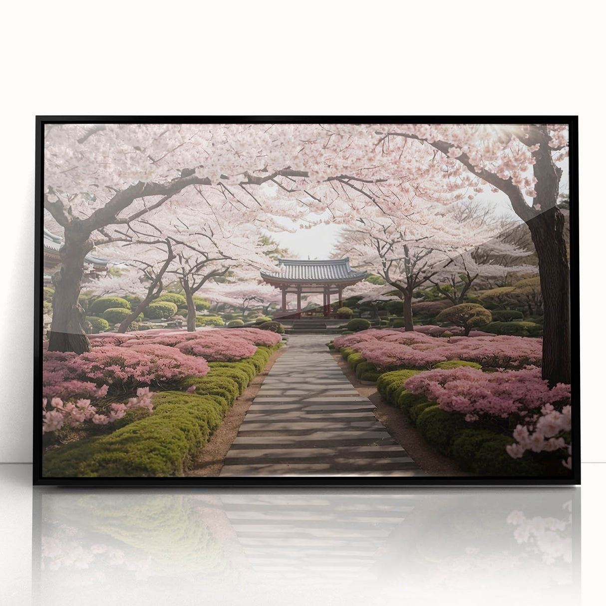 Framed botanical wall art featuring delicate cherry blossom design in vibrant pink and white hues, set against a sleek black frame, perfect for home decor.