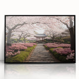 Framed botanical wall art featuring delicate cherry blossom design in vibrant pink and white hues, set against a sleek black frame, perfect for home decor.