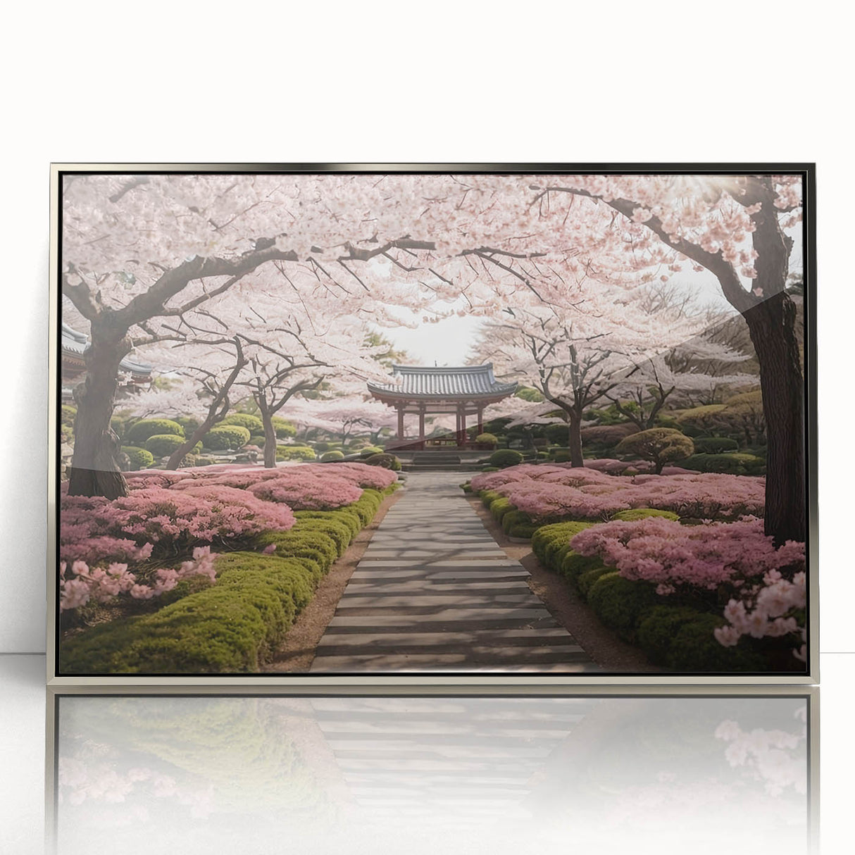 Framed botanical wall art featuring a stunning cherry blossom design in soft pink and white hues, set in a sleek silver frame, ideal for home decor enhancement.