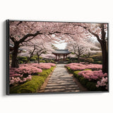 Framed canvas wall art showcasing a botanical cherry blossom design with intricate pink flowers on a black background, offering a modern touch to home decor.