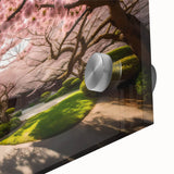 Close-up of a botanical wall art piece featuring delicate cherry blossom flowers on an acrylic glass surface, showcasing vibrant pink hues and intricate details for a serene decor accent.
