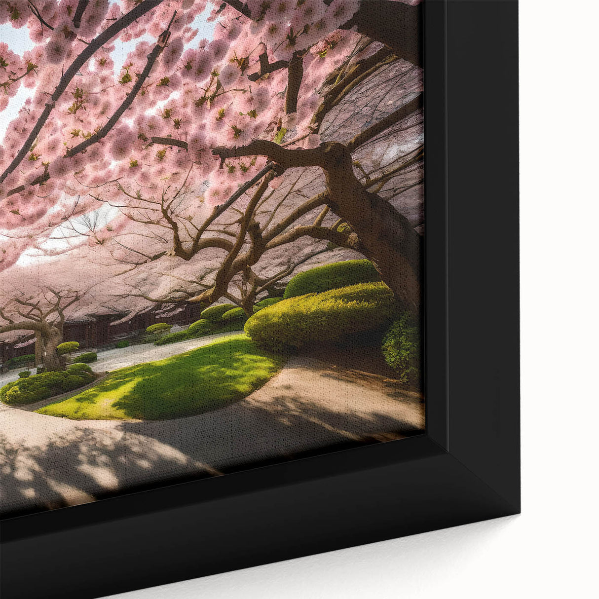 Close-up of a framed botanical wall art piece showcasing delicate pink cherry blossoms on a soft white background, perfect for home decor and spring aesthetics.