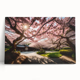 Stretched canvas wall art featuring a delicate cherry blossom design in soft pink and white hues, elegantly leaning against a neutral backdrop, perfect for home decor.