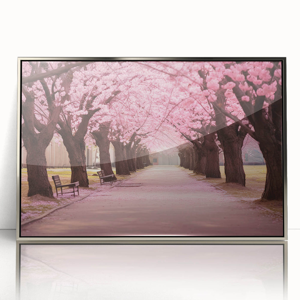 Framed wall art featuring a botanical cherry blossom design in soft pink and white tones, set against a sleek silver frame for an elegant touch to home decor.