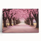 Cherry blossom wall art featuring a delicate pink floral design on stretched canvas, elegantly leaning against a neutral backdrop, ideal for home decor.