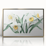 Framed botanical wall art featuring vibrant yellow daffodils with gold accents, perfect for adding a touch of elegance to home decor. Ideal for floral enthusiasts.