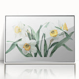 Framed botanical wall art featuring a daffodil design in vibrant yellow and green colors, showcasing elegant floral details against a sleek white frame, ideal for home decor.