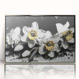 Framed acrylic wall art featuring a botanical design of vibrant daffodils in silver accents, perfect for enhancing home decor with a fresh, floral touch.