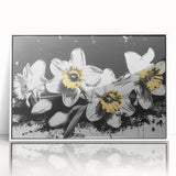 Framed botanical wall art featuring a vibrant daffodil design in a white frame, showcasing an elegant and modern aesthetic for home decor. Ideal for floral enthusiasts.