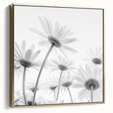 Framed botanical wall art featuring a delicate daisy design in silver and gold tones, perfect for adding a touch of nature-inspired elegance to home décor.