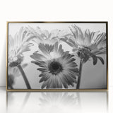 Framed wall art showcasing a botanical daisy design in vibrant colors with a gold-acrylic finish, perfect for adding elegance to any home decor.