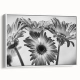 Framed botanical wall art featuring a delicate daisy design on canvas, showcasing intricate details and vibrant colors with a sleek white frame, perfect for home decor.