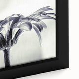 Framed close-up of botanical wall art showcasing vibrant daisies on canvas, highlighting intricate petal details and rich colors, perfect for home decor.