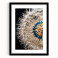 Botanical wall art featuring a delicate dandelion design in a sleek black frame, with a white mat for a modern aesthetic, ideal for home decor.
