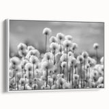Framed botanical wall art featuring a delicate dandelion design on a canvas, showcased from the side against a white background, ideal for home decor.