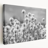 Stretched canvas wall art showcasing an elegant dandelion botanical design in soft pastel colors, perfect for home decor and nature-themed interior styling.