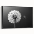 Framed black canvas wall art featuring a detailed botanical dandelion design, showcasing intricate textures and vibrant colors, ideal for modern home decor.