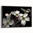 Framed botanical wall art featuring a dogwood flower design on a black background, showcasing intricate details and vibrant colors, perfect for home decor.