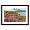 Framed botanical wall art featuring vibrant fireweed flowers, set in a sleek black frame with a mat, perfect for home decor and nature enthusiasts. Ideal for brightening living spaces.