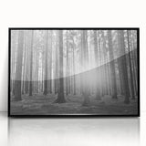 Framed wall art featuring a botanical forest design with vibrant flowers and trees, set in a sleek black frame, perfect for nature-inspired decor.