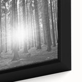 Close-up of a framed canvas wall art featuring a botanical forest design with vibrant flowers and intricate tree details, perfect for nature-themed decor.