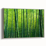Framed canvas wall art showcasing a botanical forest design with lush greenery and elegant trees, featuring a sleek silver frame, perfect for home decor.
