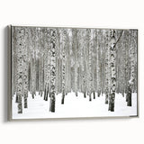 Framed canvas wall art featuring a serene botanical forest design with trees, set against a silver frame, perfect for nature-inspired home decor.