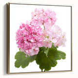 Framed botanical wall art featuring a vibrant geranium design in hues of pink and green, elegantly displayed with a silver and gold frame, perfect for home decor.