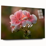 Acrylic wall art featuring a botanical geranium design, showcasing vibrant green leaves and delicate pink flowers, displayed from a side view on a clean white background.