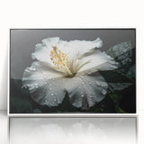 Framed acrylic wall art showcasing a vibrant botanical hibiscus design with bright colors, set against a white frame, perfect for home decor enhancement.