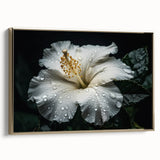 Framed canvas wall art depicting a vibrant hibiscus botanical design with gold accents, showcasing a side view of the artwork against a neutral backdrop. Ideal for home decor enthusiasts.