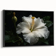 Framed canvas wall art showcasing a vibrant hibiscus botanical design with a black frame, ideal for home decor. Perfect for adding a tropical touch to living spaces.