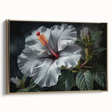 Framed canvas wall art showcasing a vibrant botanical hibiscus design in gold tones, elegantly displayed from the side, emphasizing its artistic details and texture.