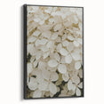 Framed canvas wall art showcasing a botanical hydrangea design with a black frame, elegantly displayed from a side view, perfect for home decor.