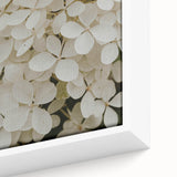 Close-up of a beautifully framed botanical hydrangea wall art design, showcasing vibrant blue and green hues with intricate petal details, perfect for home decor. This canvas piece adds a touch of nature-inspired elegance to any room, enhancing aesthetic appeal.