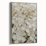 Framed canvas wall art showcasing a botanical hydrangea design with silver accents, offering a side view of vibrant floral details and elegant framing. Perfect for home decor.