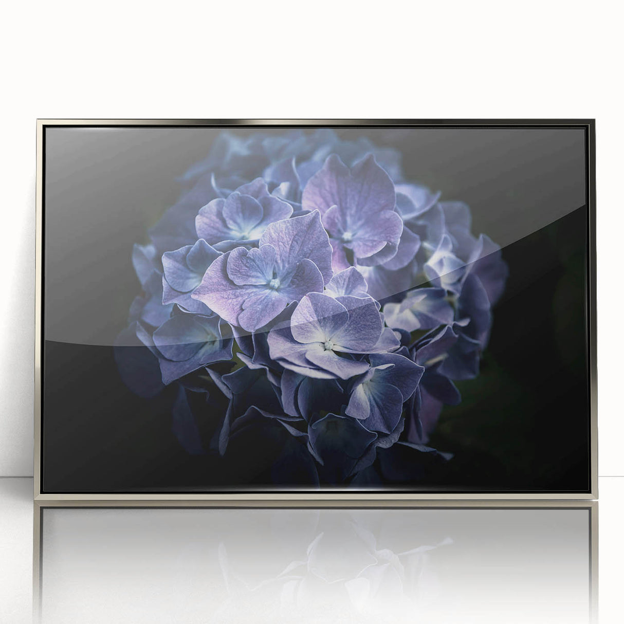 Framed wall art featuring a botanical hydrangea design in vibrant blue and green hues, set in a sleek silver frame, perfect for home decor enhancement.