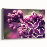 Framed wall art featuring a botanical lavender design on canvas, showcasing soft purple hues and elegant silver framing, ideal for home decor enhancement.